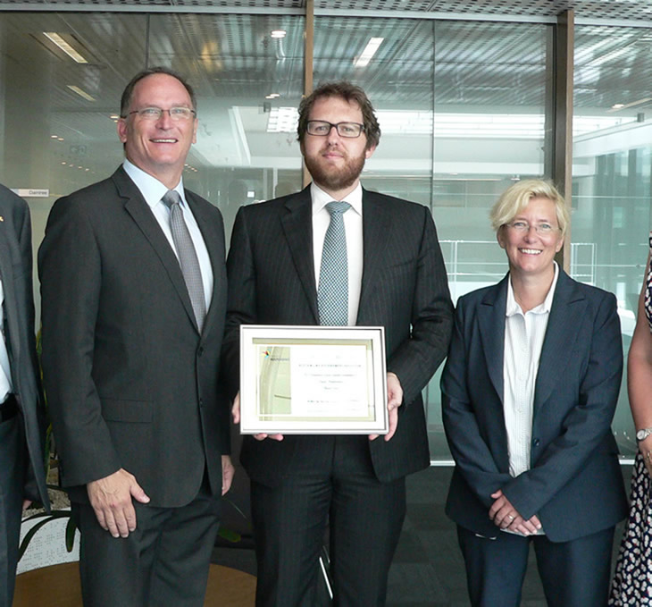 Chairman of Project Independence Glenn Keys (left) presenting OGC’s Counsel Alex Kunzelmann and Senior General Counsel Genevieve Ebbeck with a certificate of appreciation for the pro bono legal advice they provided