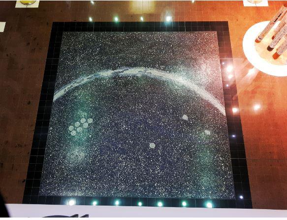 Image of the mosaic floor in the Northern Territory Supreme Court building entitled&nbsp;The Milky Way dreaming, based on a painting by Nora Napaltjara Nelson.