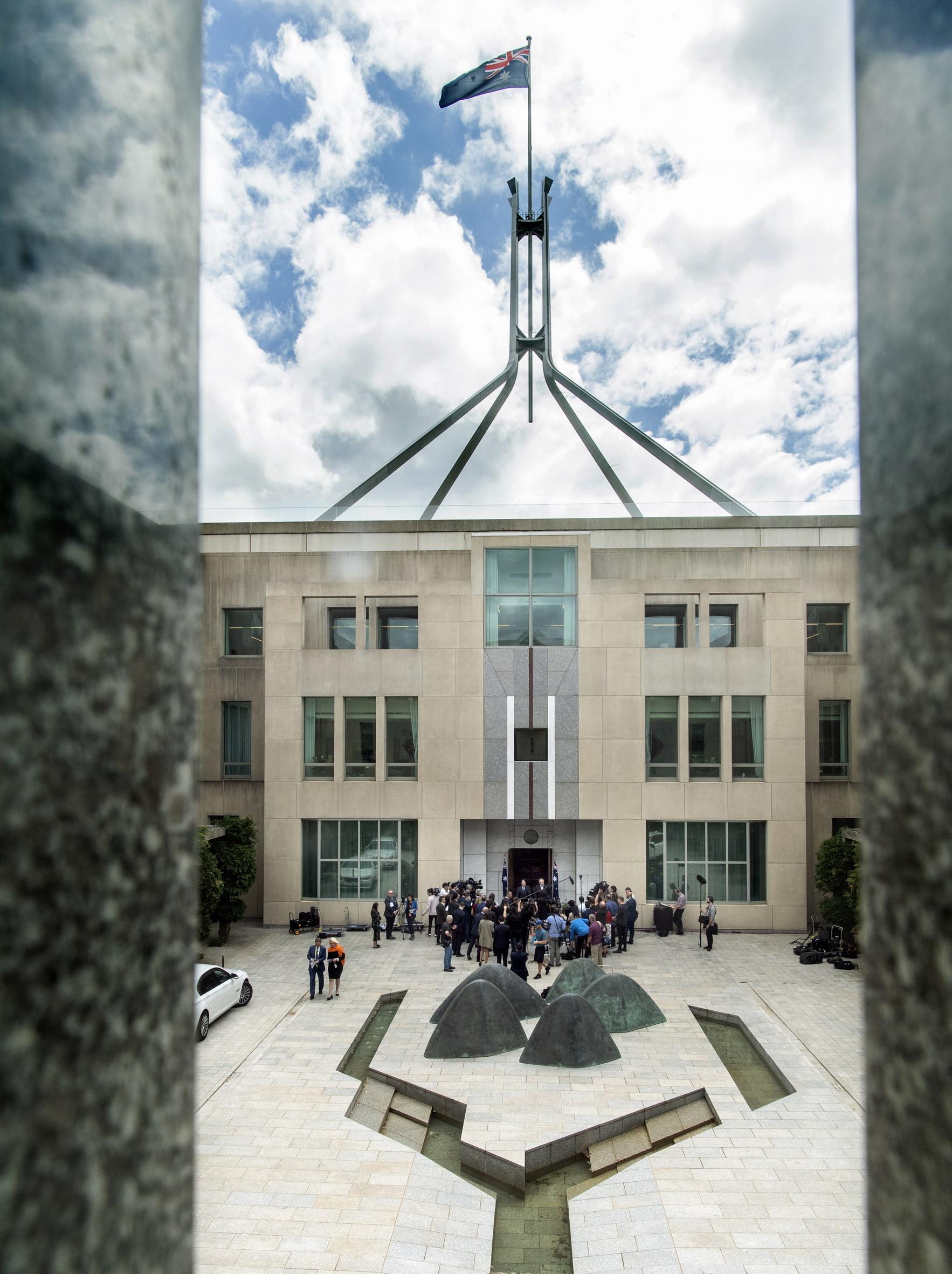 A press conference outside the Prime Minister’s office in Australian Parliament House, Canberra, in front of a sculpture by Marea Gazzard entitiled Mingarri (Little Olgas).